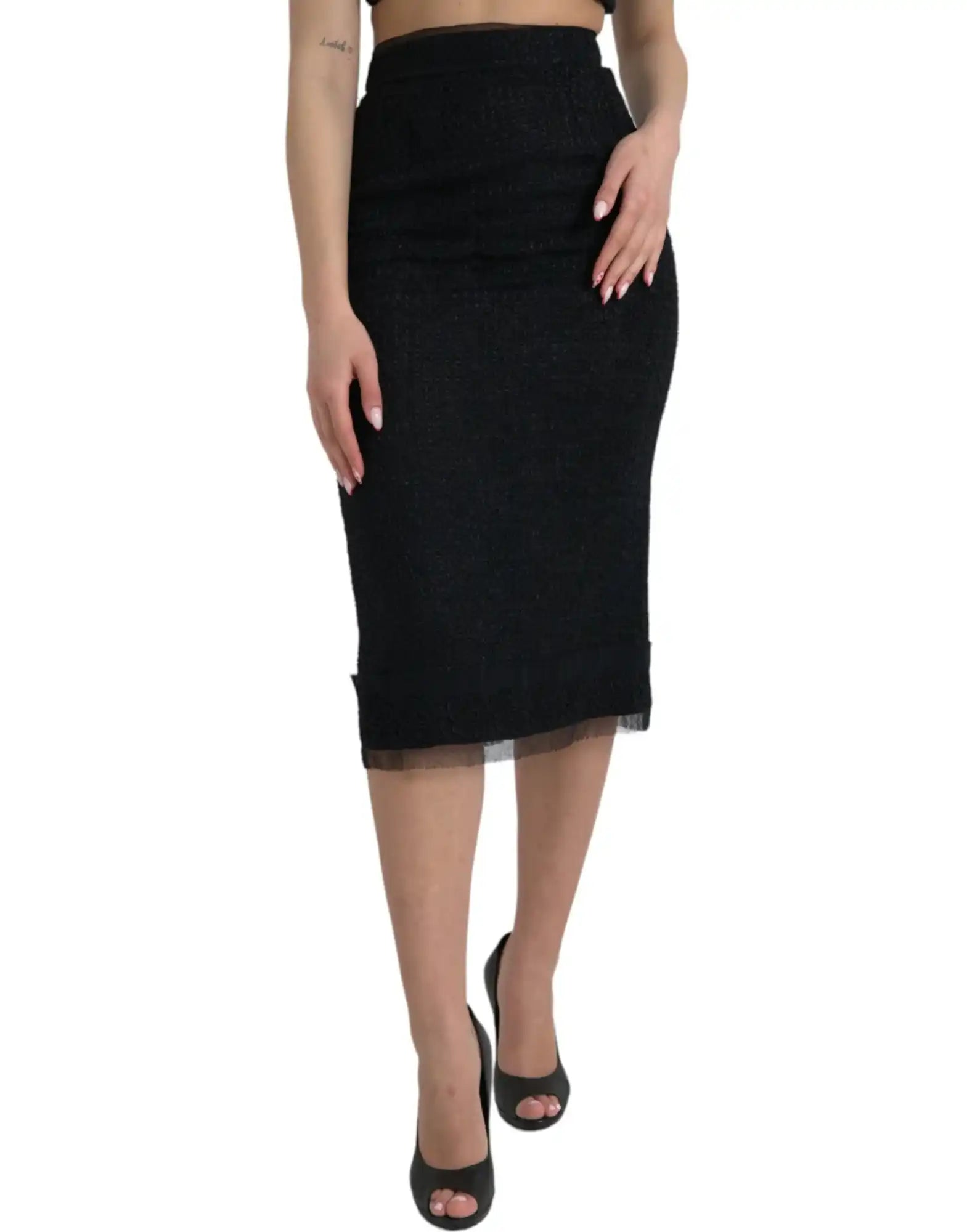 Black pencil skirt with mesh trim detail at the hem.