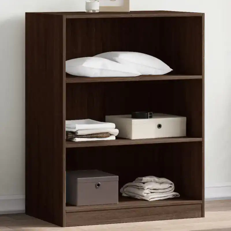 Dark brown wooden bookshelf with three shelves holding various storage items.