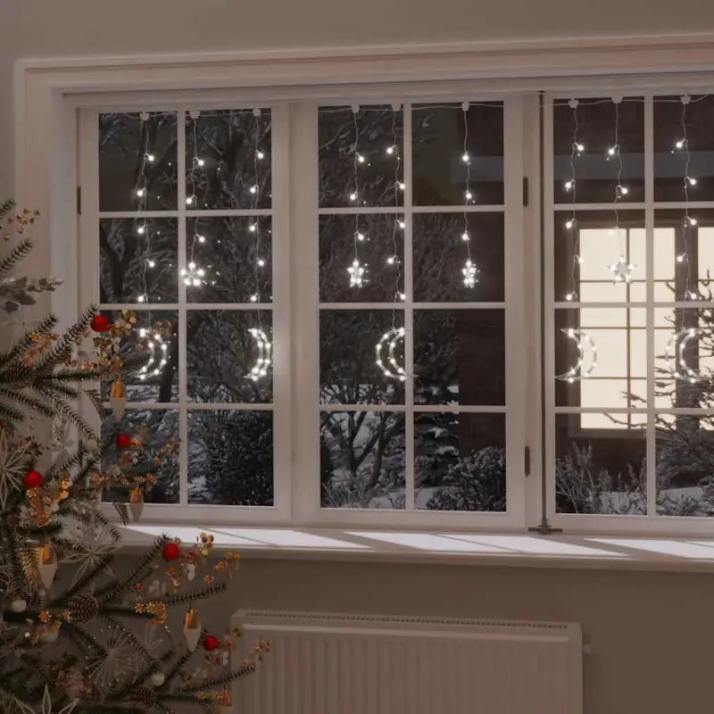 Energiebesparende LED’s kerstverlichting met sterren en manen en lange verlengkabel - Koudwit / 138 led / 1