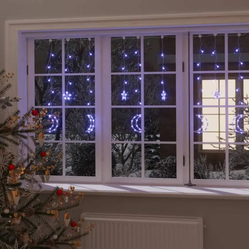 Energiebesparende LED’s kerstverlichting met sterren en manen en lange verlengkabel - Blauw / 138 led / 1
