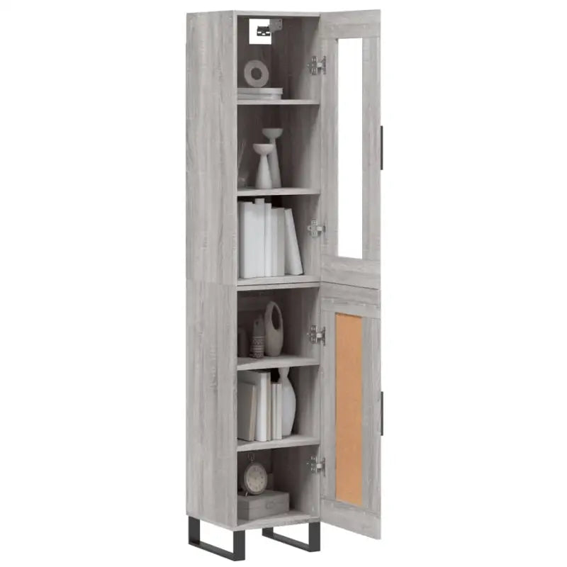 Hoge kast met ijzeren poten en bewerkt hout voor een trendy interieur - Dressoirs & buffetkasten