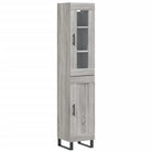 Hoge kast met ijzeren poten en bewerkt hout voor een trendy interieur - Dressoirs & buffetkasten