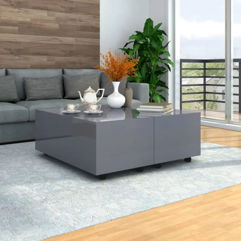 Stijlvolle salontafel van bewerkt hout met hoogglans afwerking en vergrendelbare wielen - Salontafels